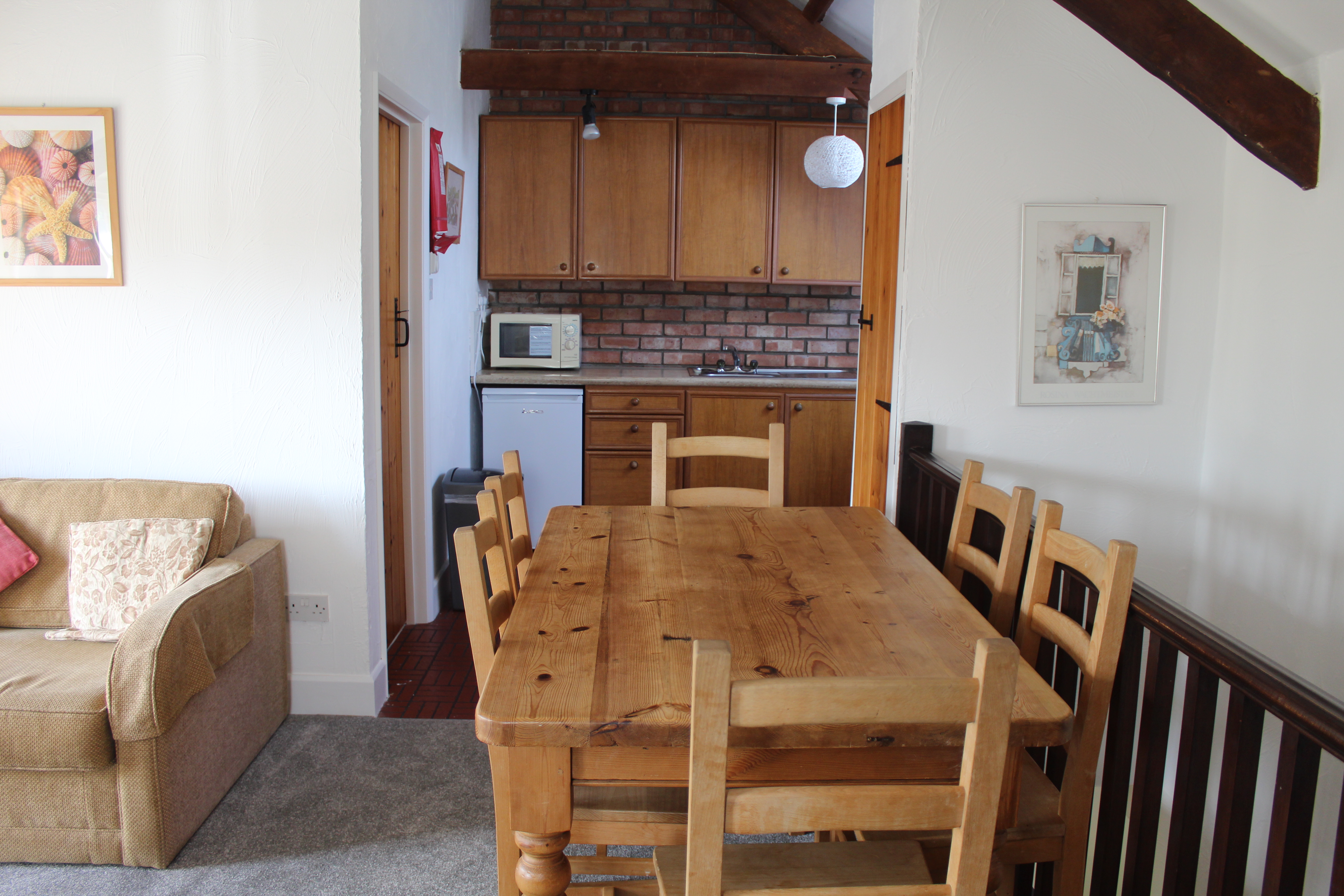 Stable Cottage open plan dining and kitchen area.